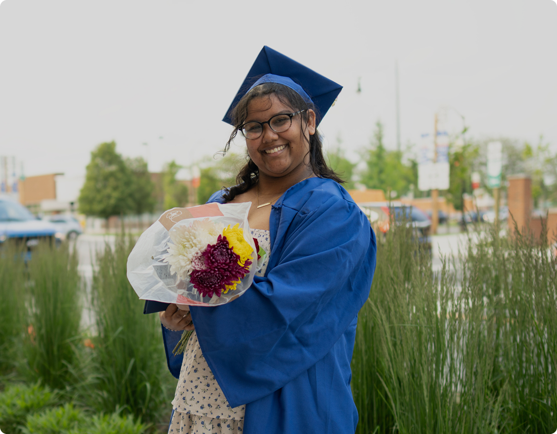 Graduated student with flowers