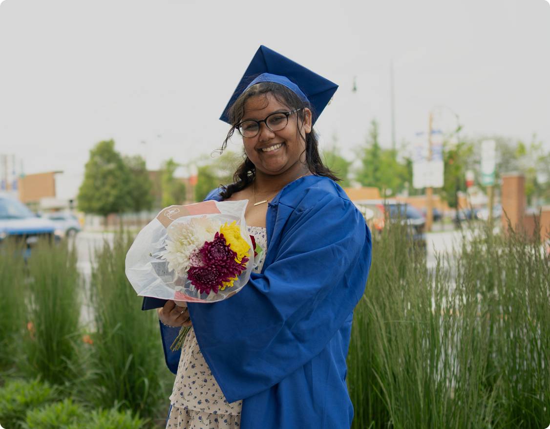 Graduated student with flowers