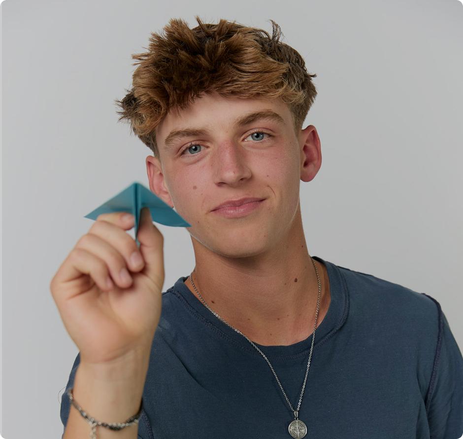 boy with paper airplane