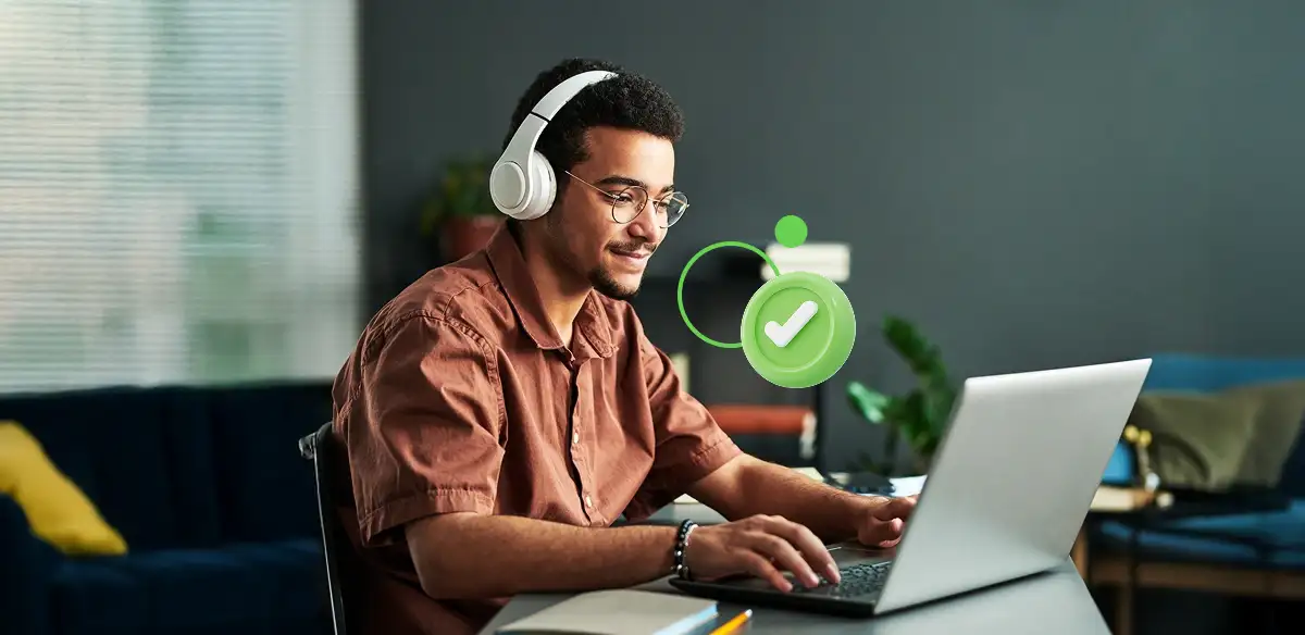 Student wearing a white pair of headphones